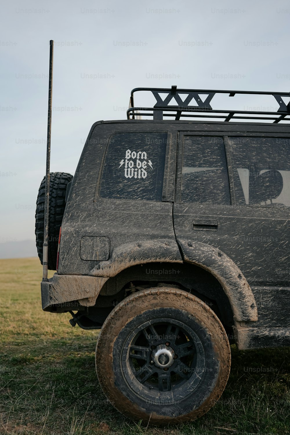 a jeep with a radio on top of it in a field