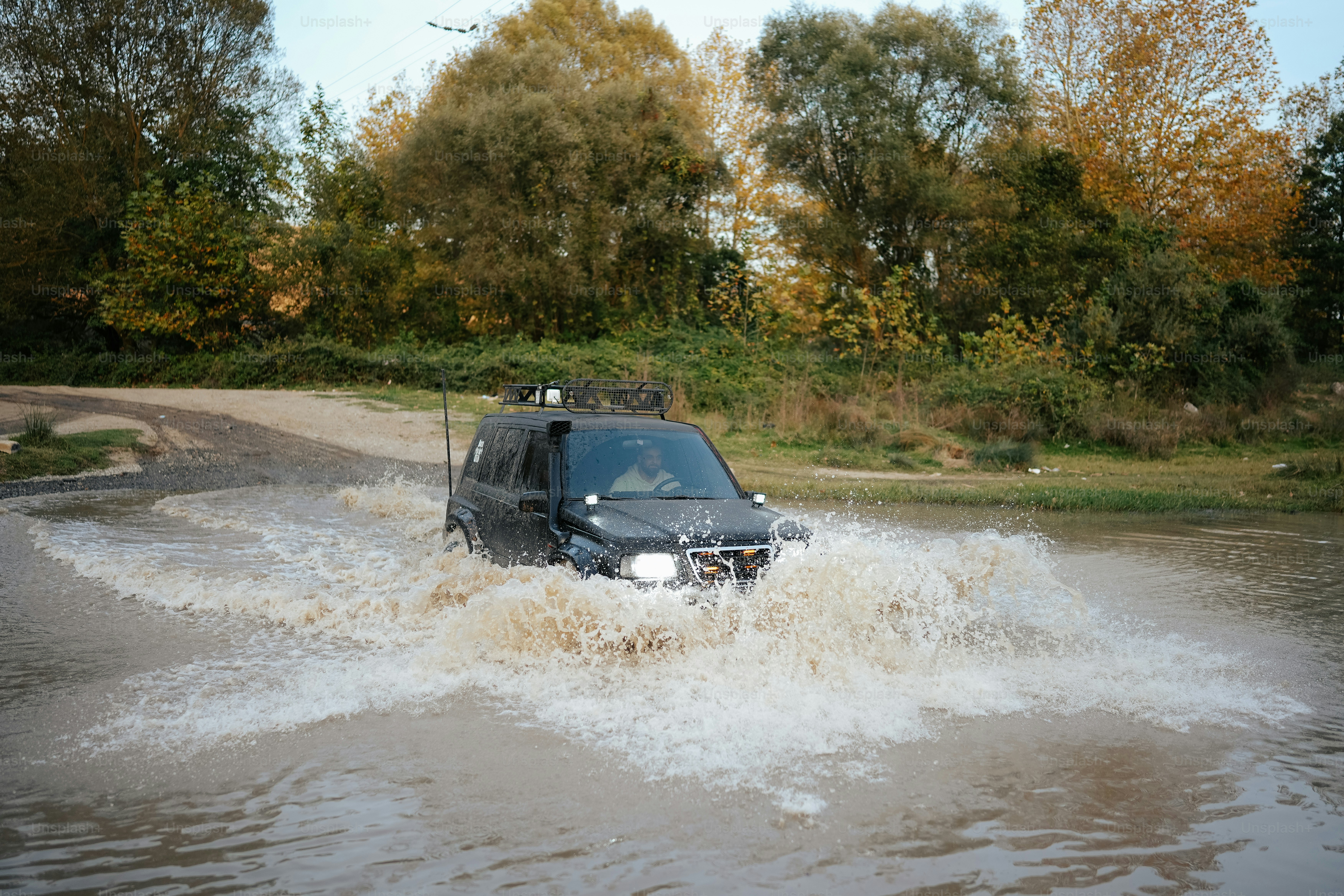 a car driving through a flooded street