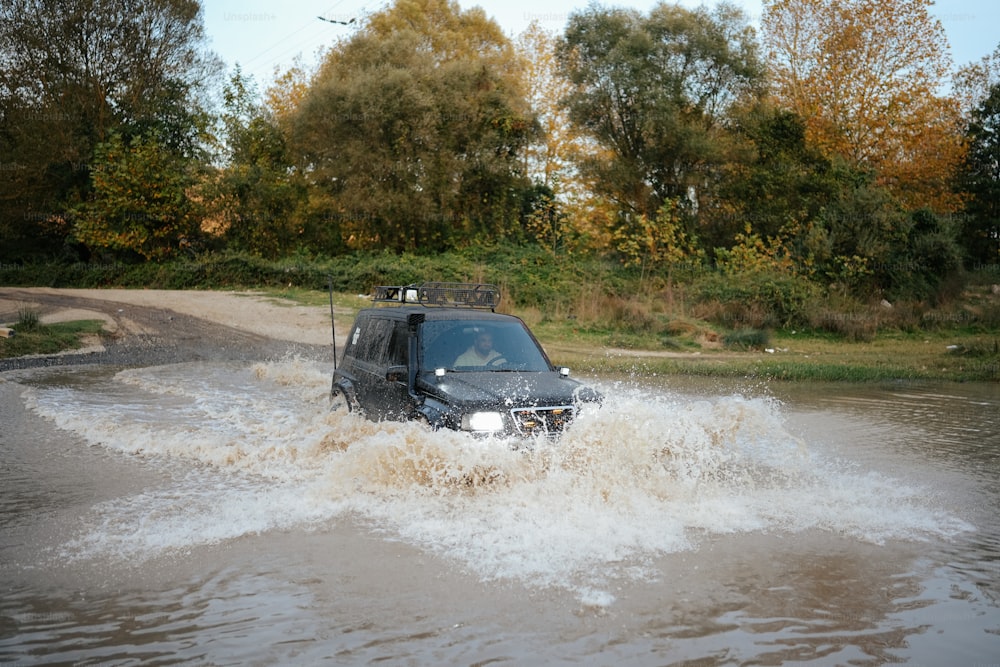 a car driving through a flooded street