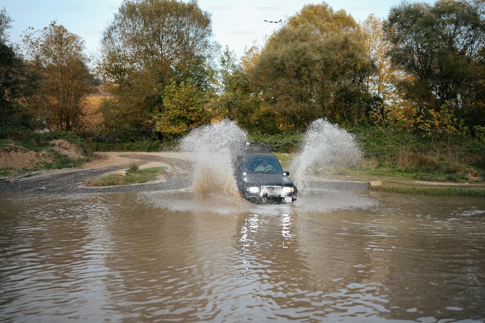 a car driving through a flooded street