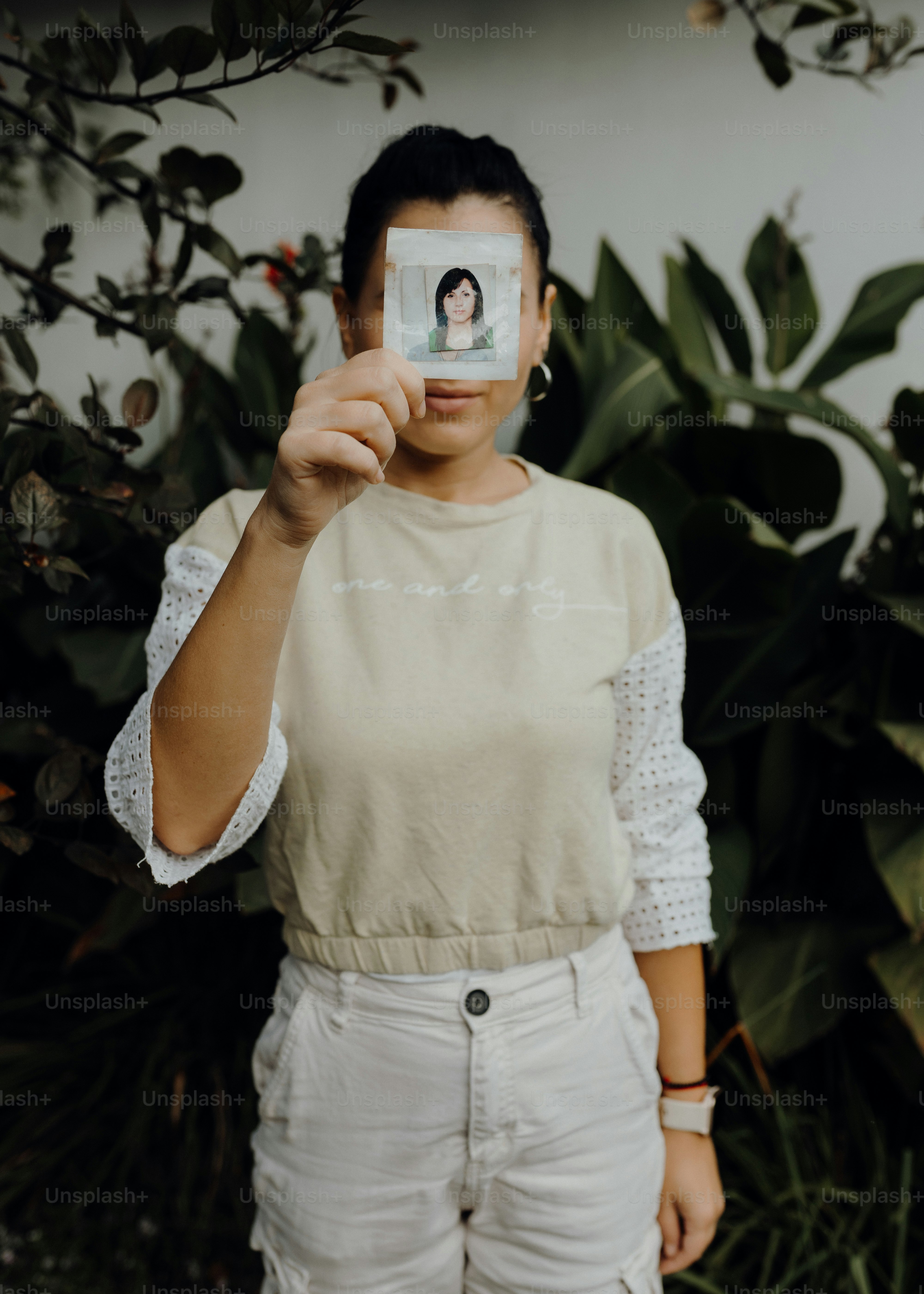 a woman holding up a card with a picture on it