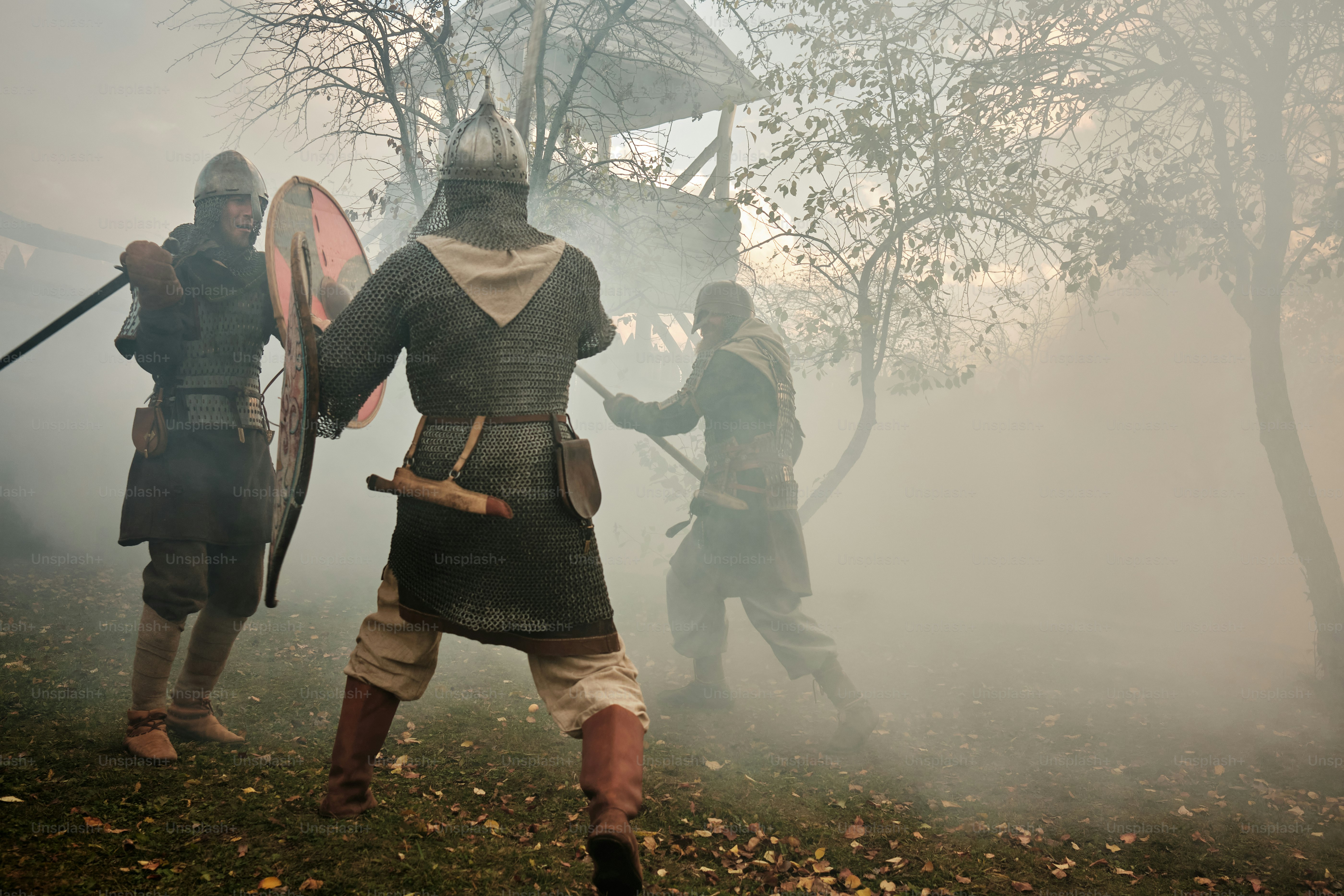 A group of men dressed in medieval costumes photo – Knight Image on ...
