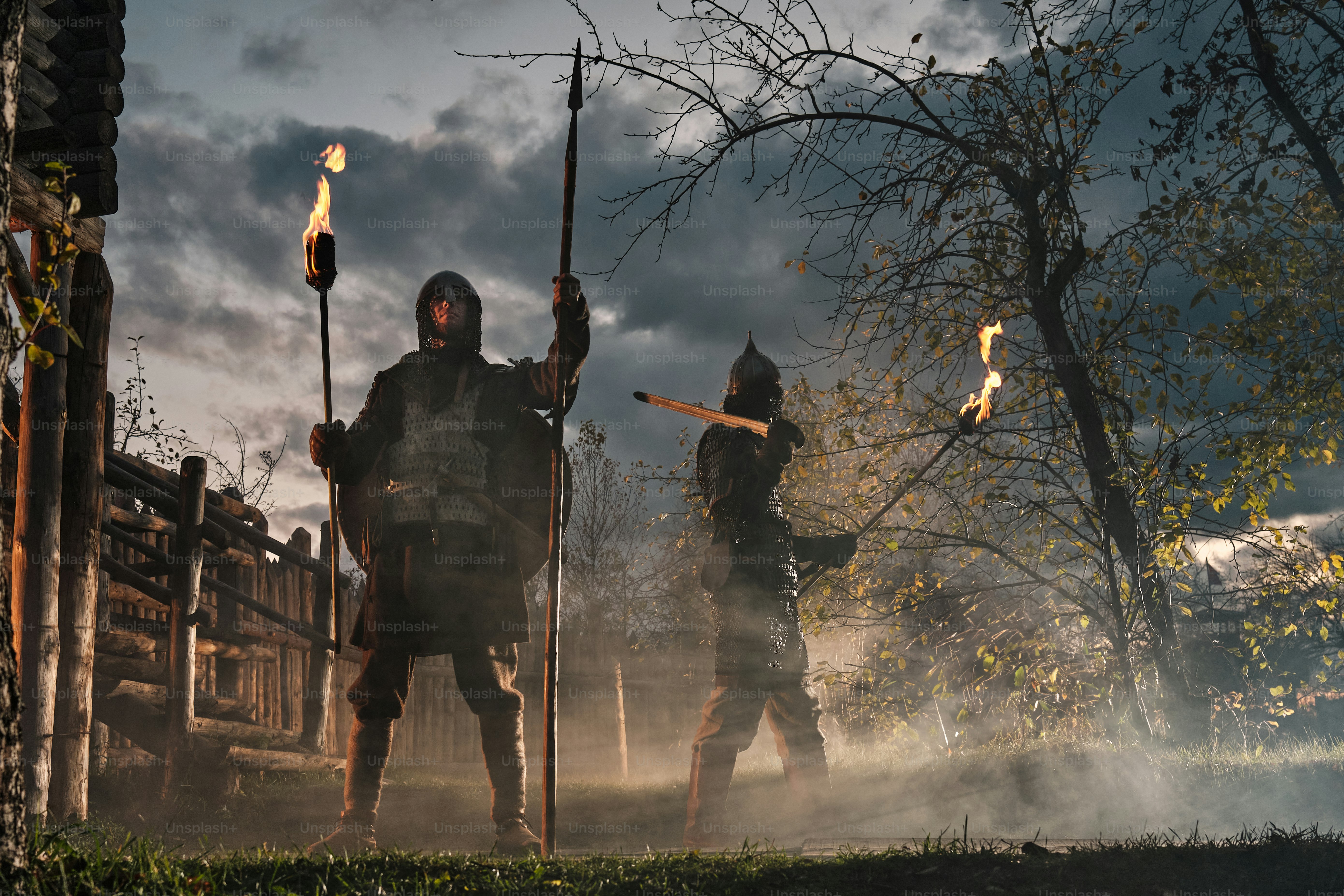 a group of men in medieval clothing holding spears