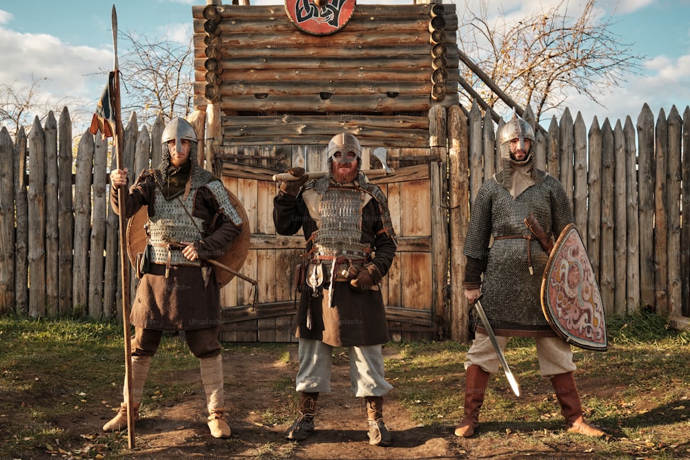 a group of men dressed in medieval costumes