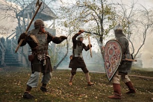 a group of men dressed in medieval costumes