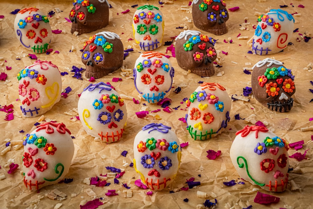 a table topped with lots of decorated chocolate eggs
