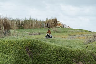 a person riding a four wheeler in a field