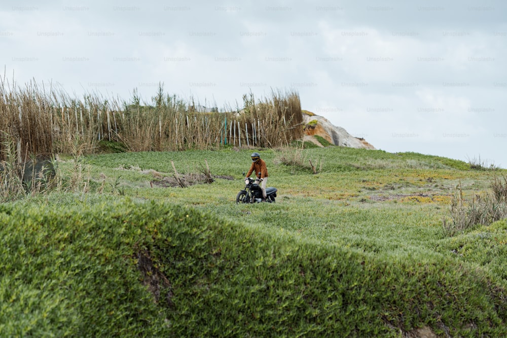 a person riding a four wheeler in a field