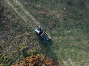 an aerial view of two people sitting on a truck