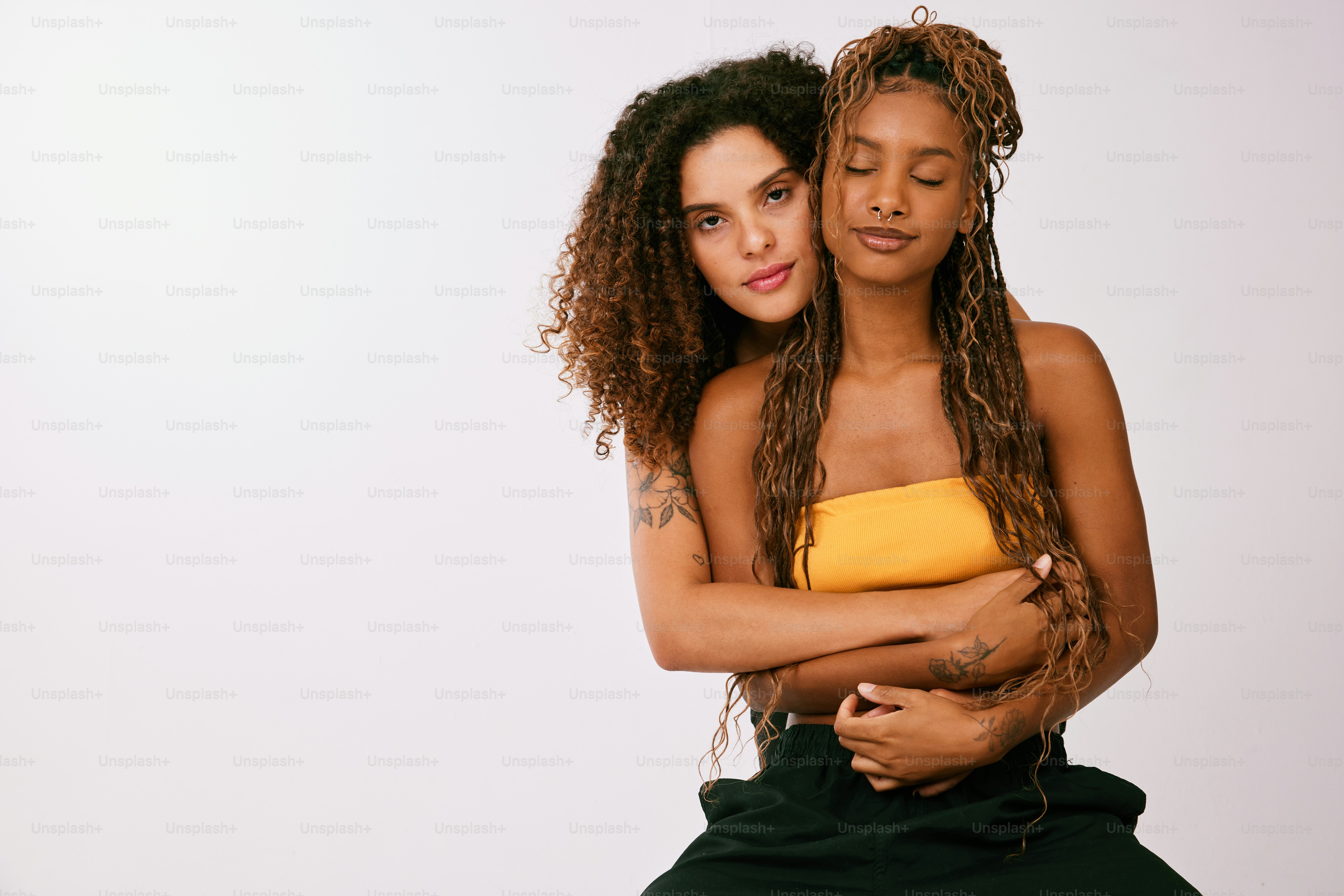 A couple of people that are hugging each other photo – Young and in ...