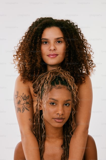 Two Women With Tattoos On Their Arms Posing For A Picture Photo Modern Romance Image On Unsplash 