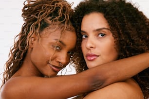 a couple of women standing next to each other