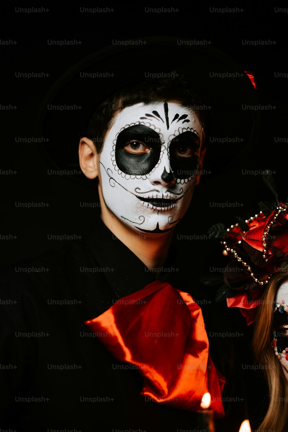 a man and a woman in skeleton makeup