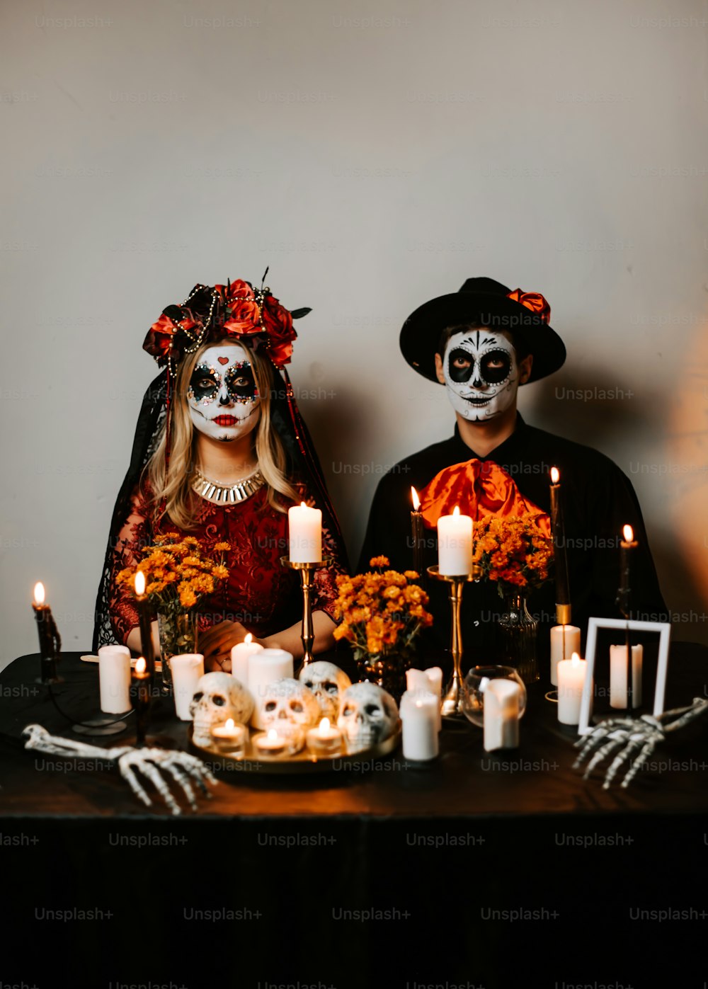 a couple dressed up in skeleton makeup for halloween