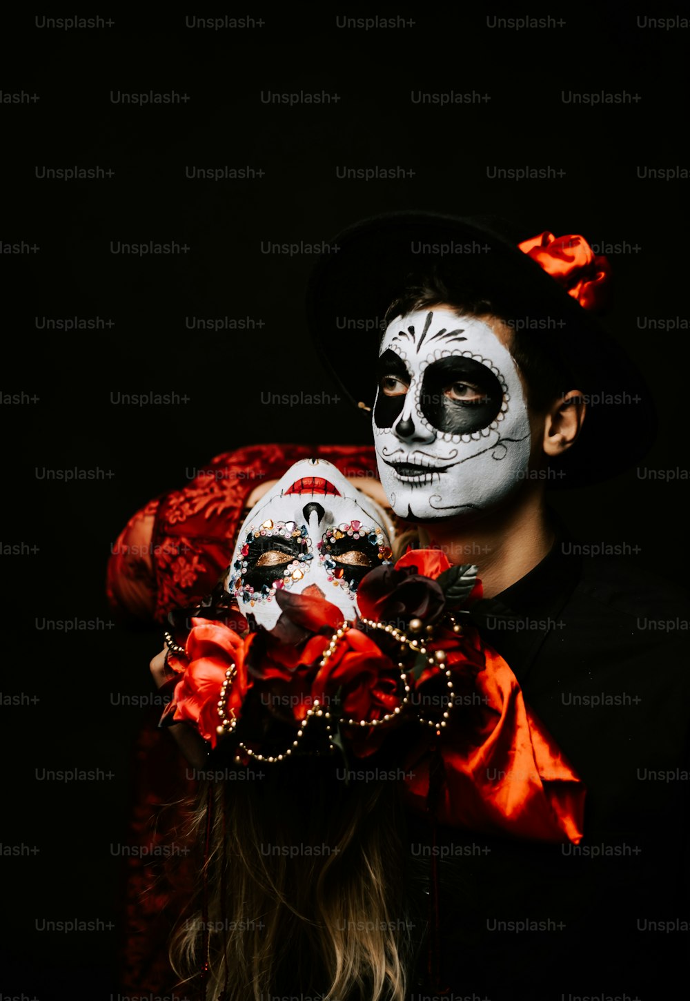 a woman with a skeleton face painted on her face