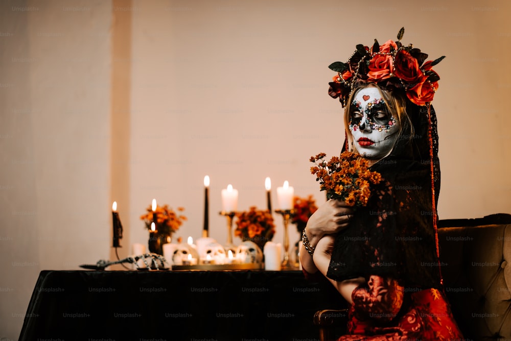 a woman in a skeleton mask holding a bouquet of flowers