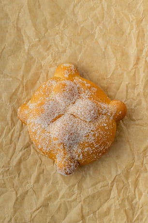 a pastry with powdered sugar on top of it