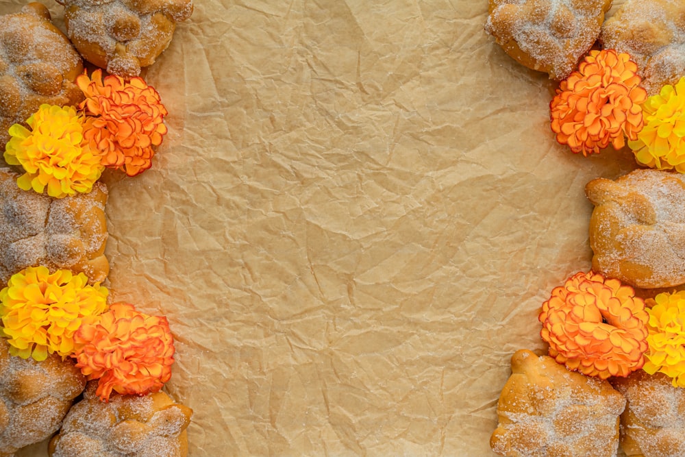 a bunch of doughnuts that have flowers on them