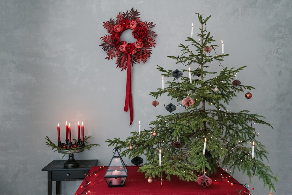 a christmas tree with a wreath on top of it