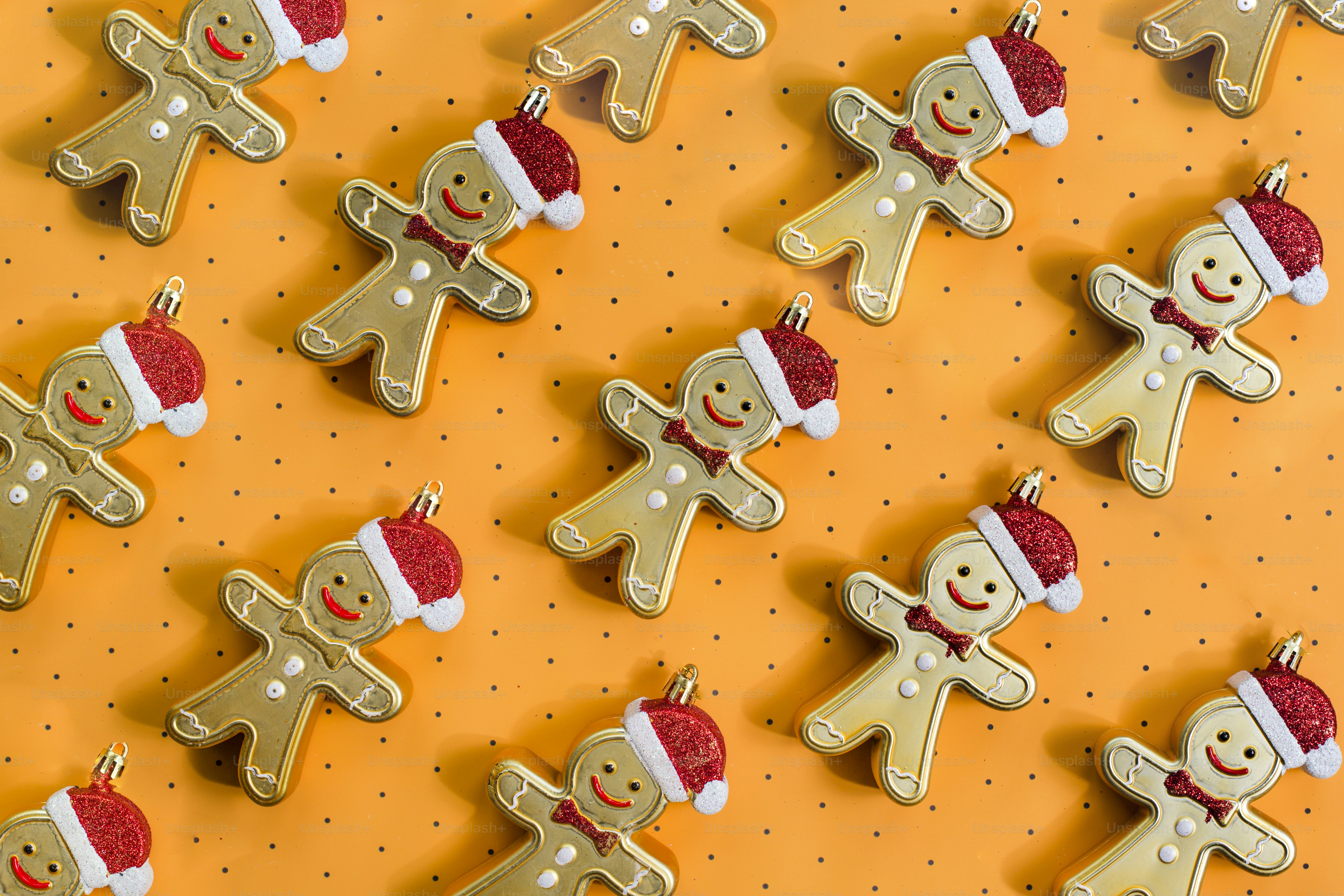 a group of gingerbread men and women on a yellow background