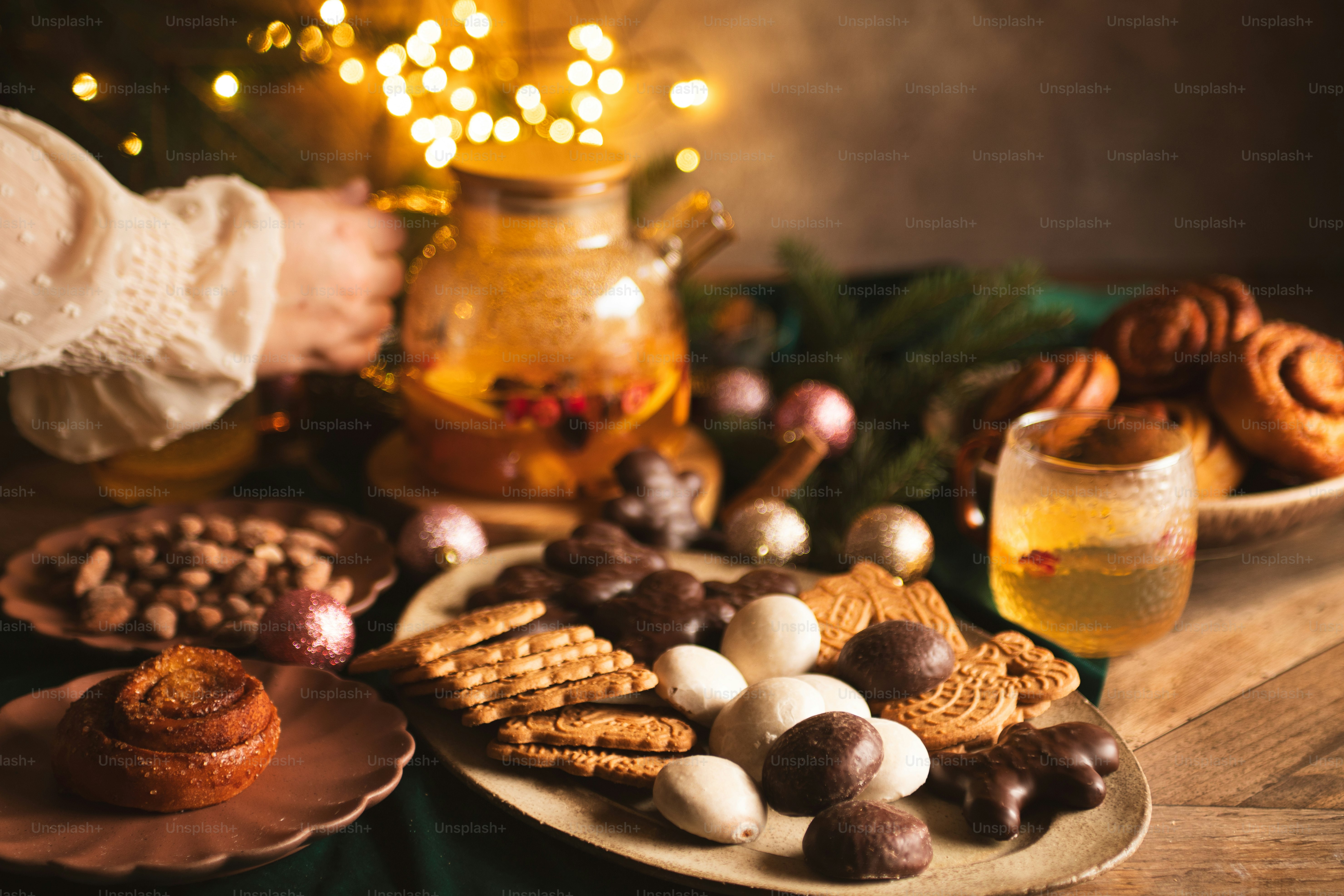 a table topped with plates of food and a glass of wine
