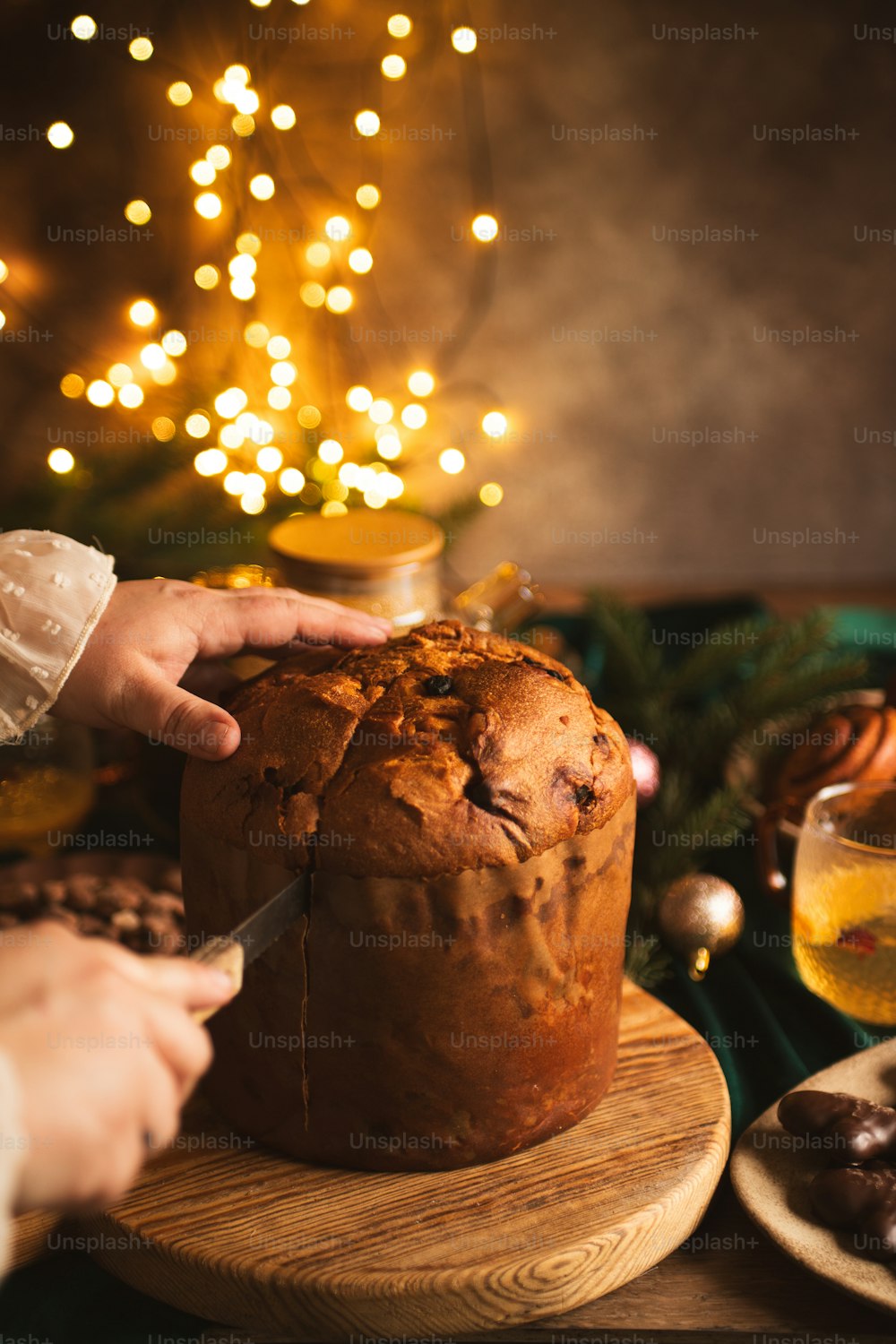 a person cutting a cake with a knife