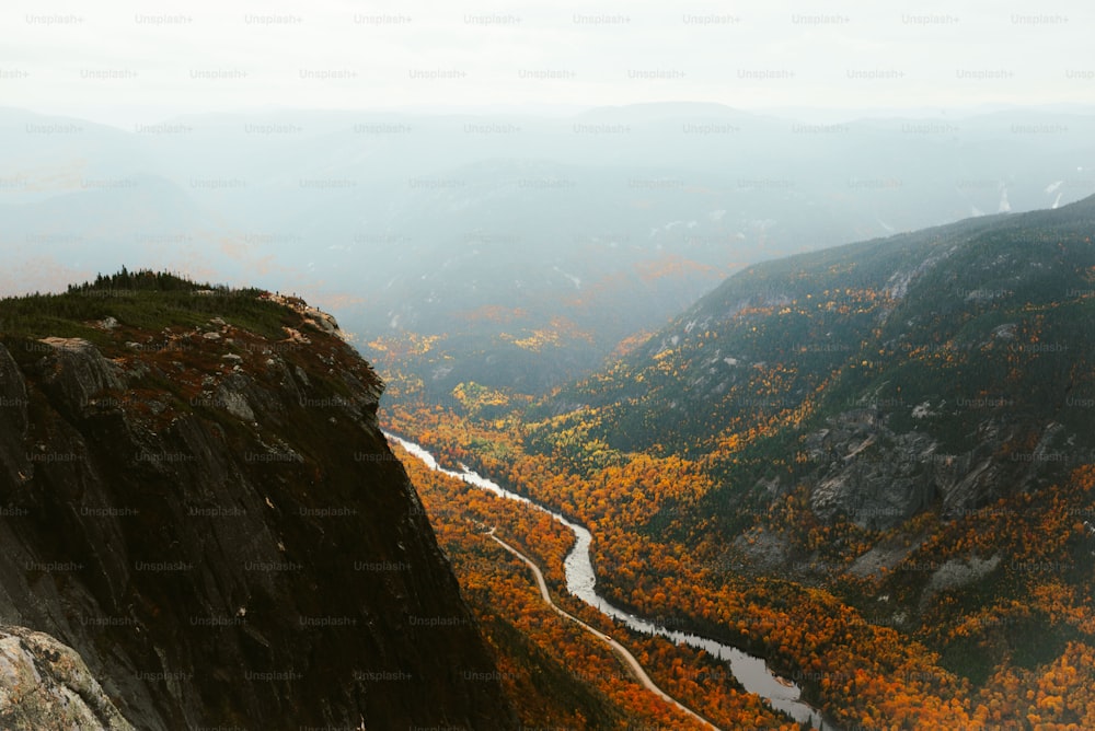 a view of a valley with a river running through it