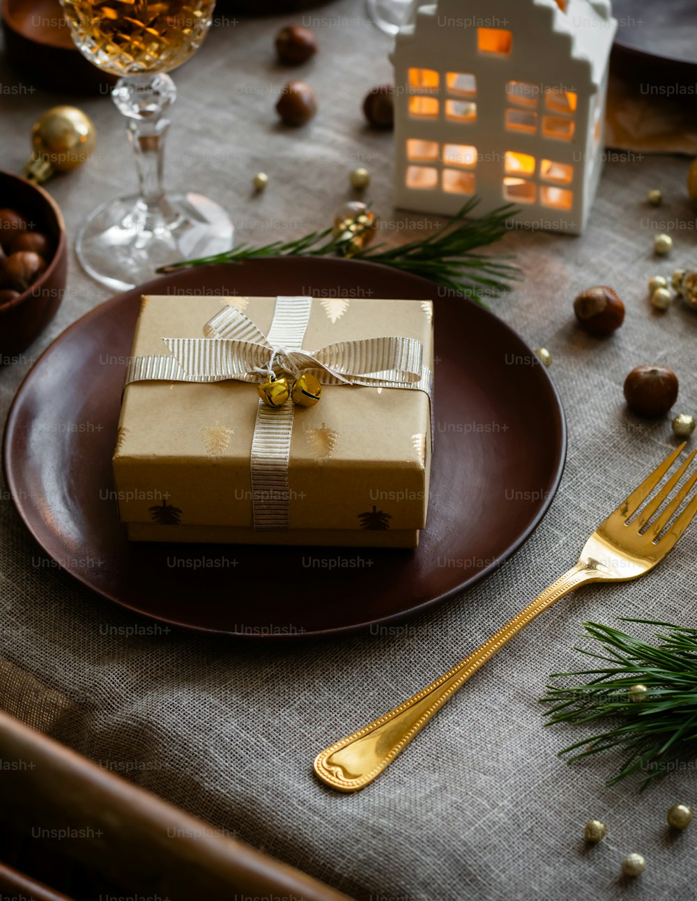 a brown plate topped with a wrapped present