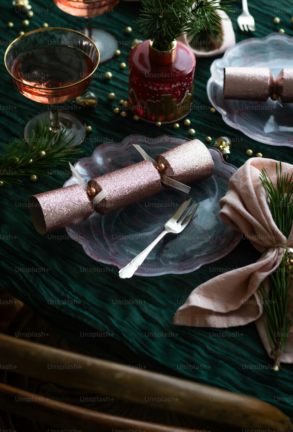 a table set for a holiday dinner with napkins and napkins