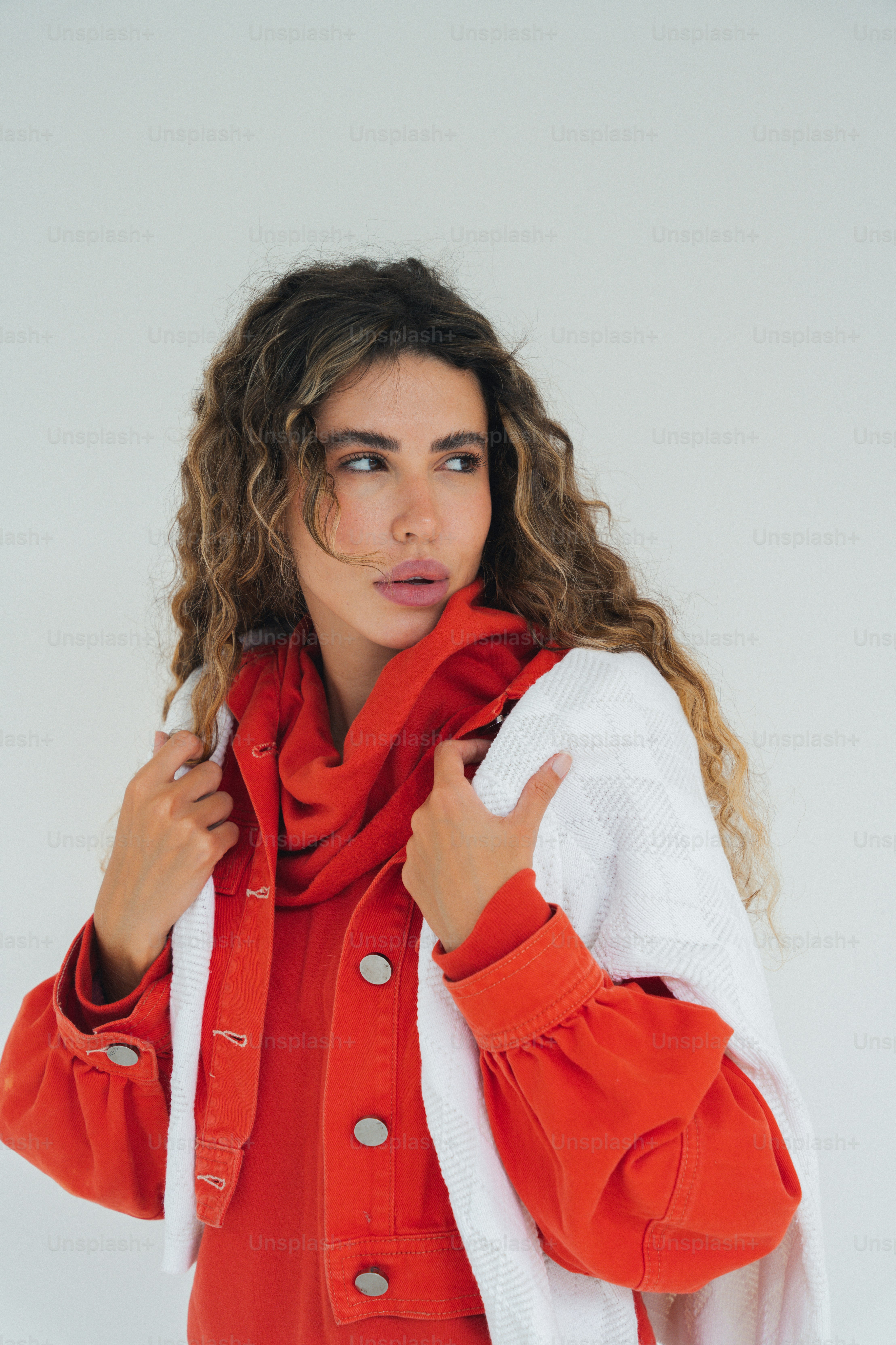 A woman wearing a red jacket and a white shirt photo Portrait Image