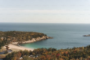 a scenic view of a beach and a body of water