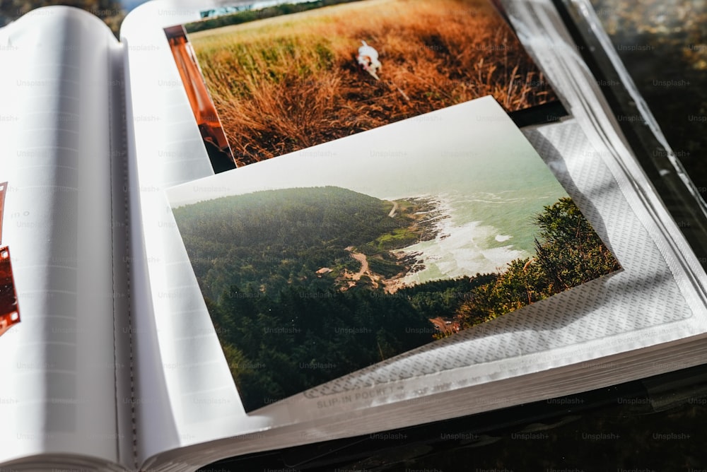 an open book with pictures of a beach