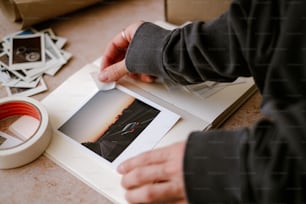 a person cutting a picture with a knife