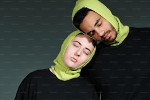 a man and a woman with a hood on their heads