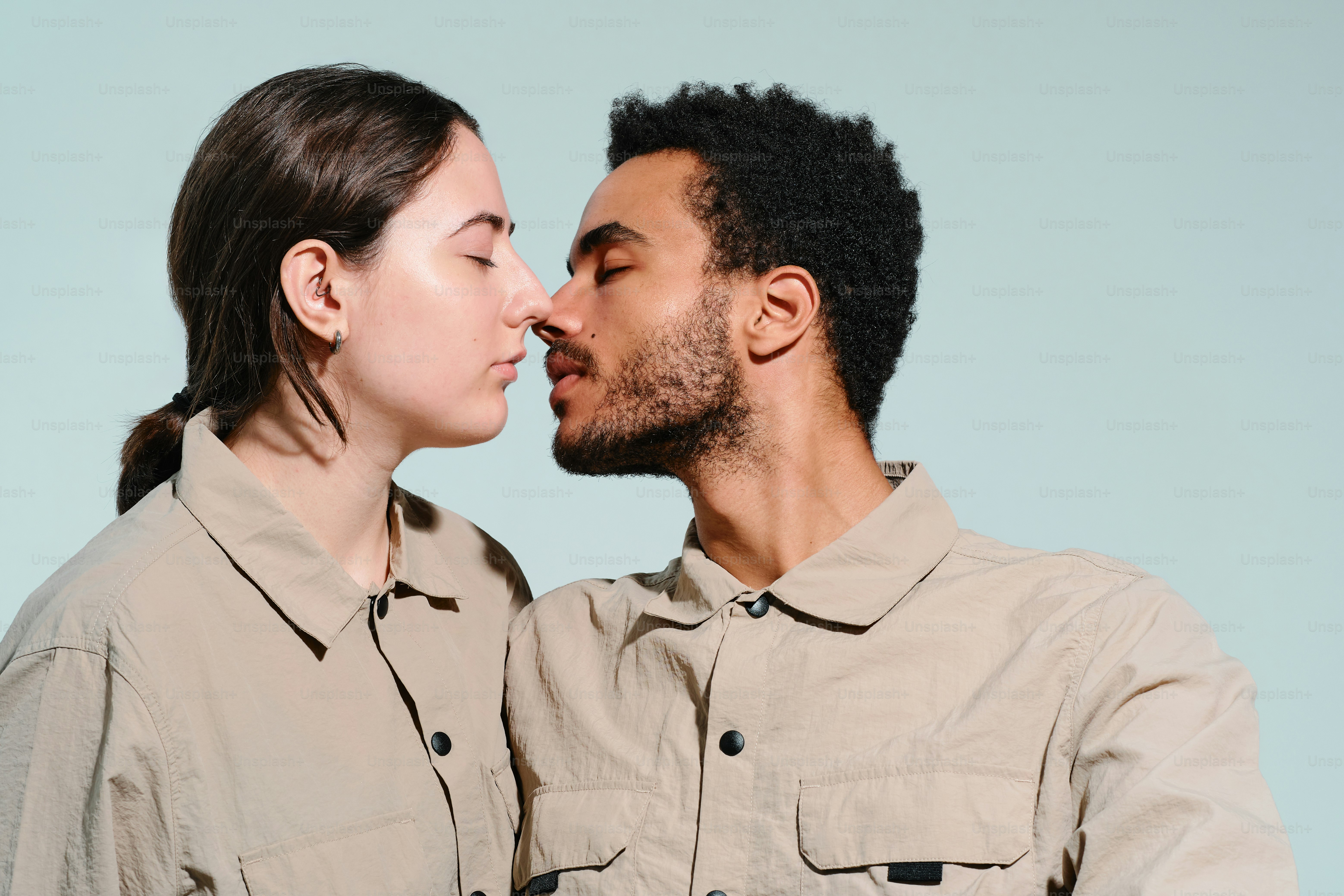 Studio portrait of a multinational couple in a moment of tenderness