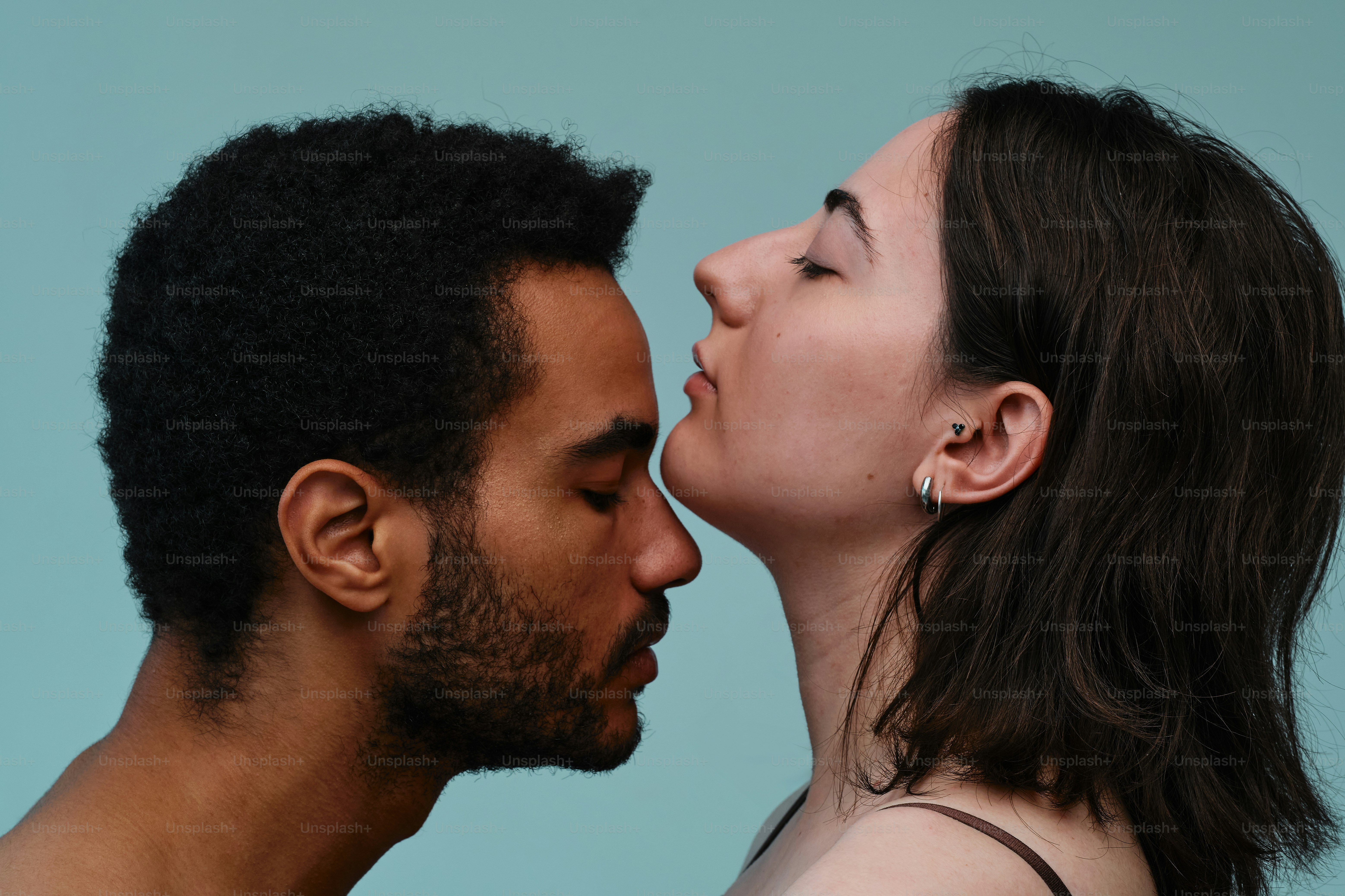 Studio portrait of a multinational couple in a moment of tenderness