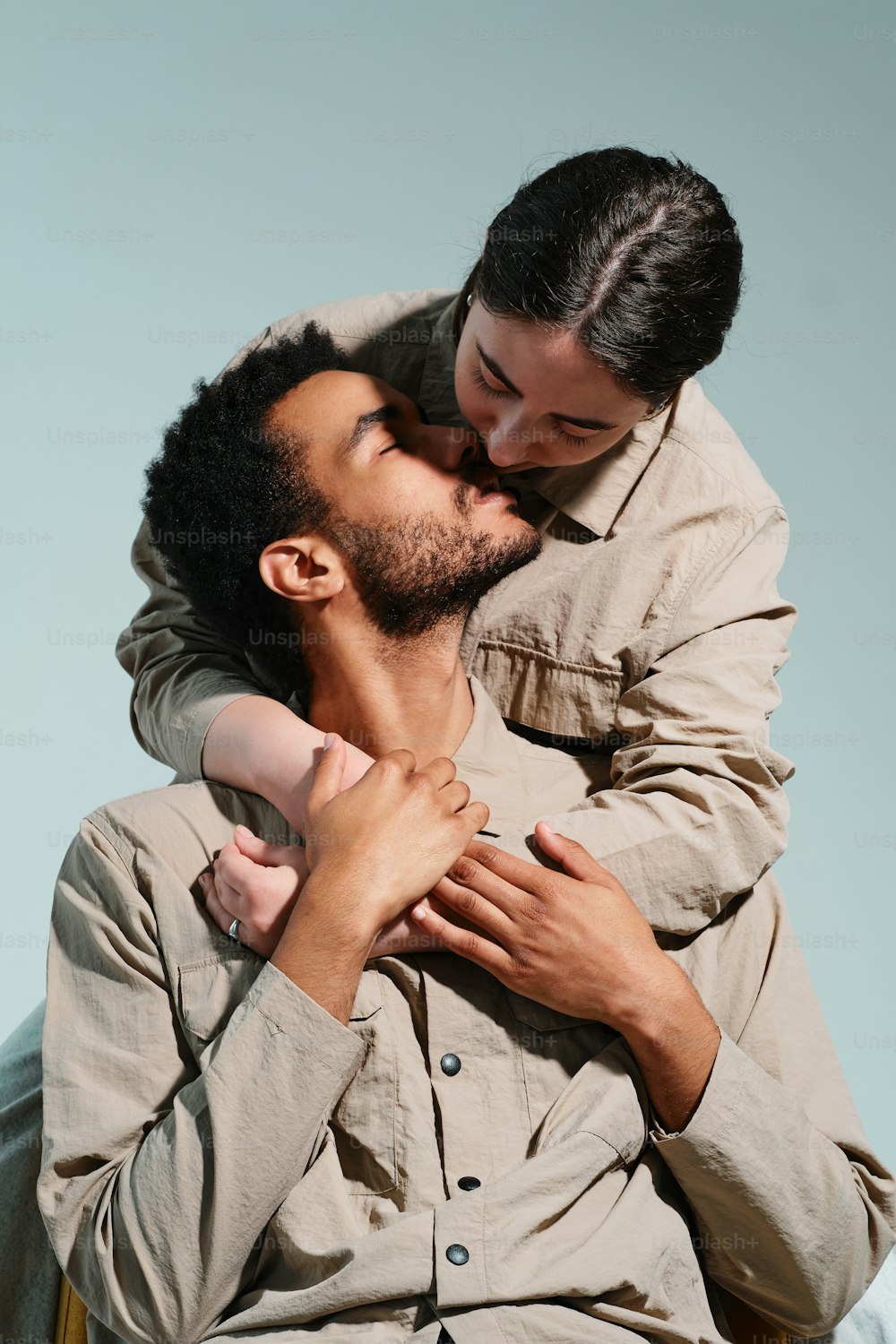 a man holding a woman on his back