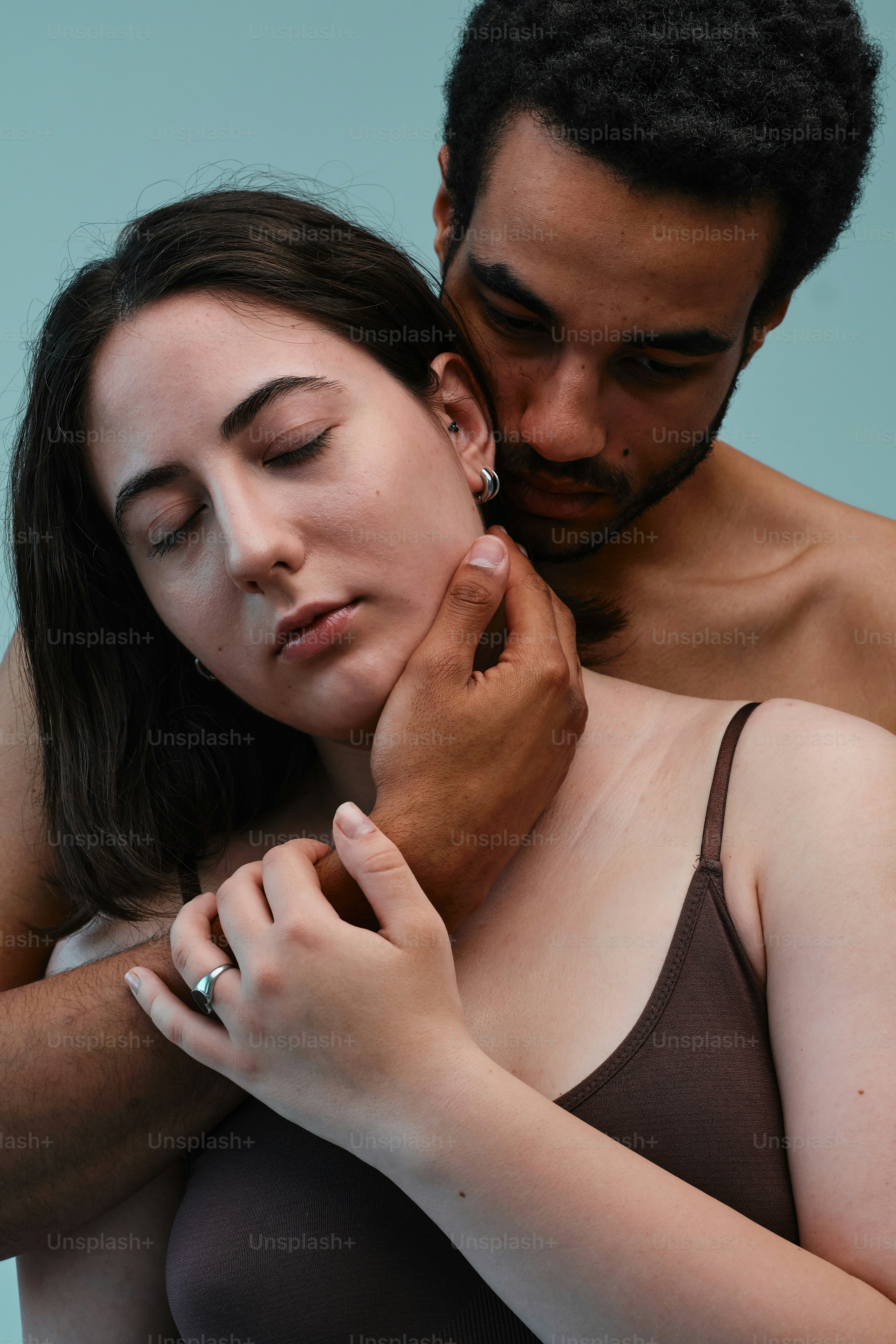 Studio portrait of a multinational couple in a moment of tenderness