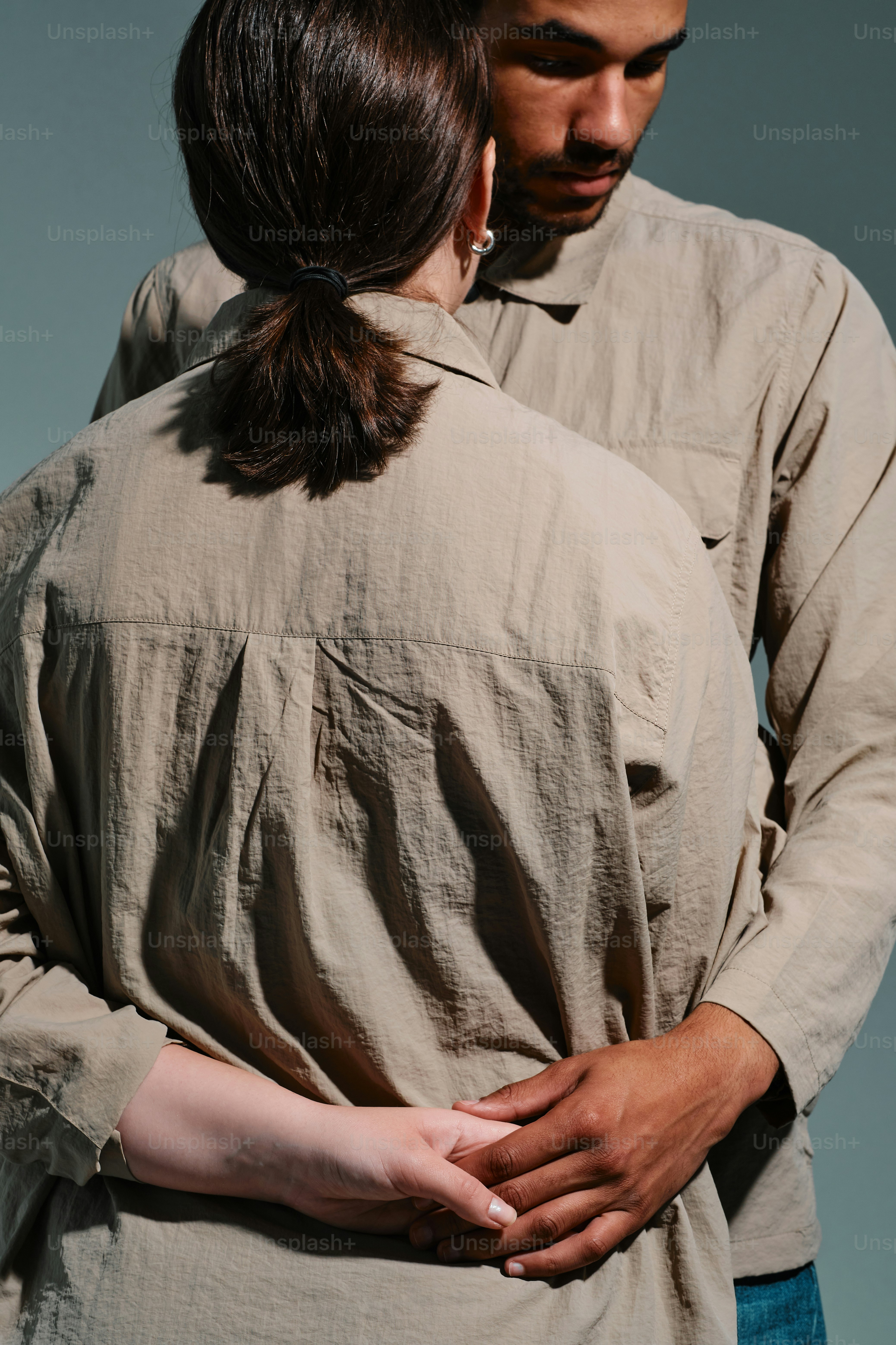 Studio portrait of a multinational couple in a moment of tenderness