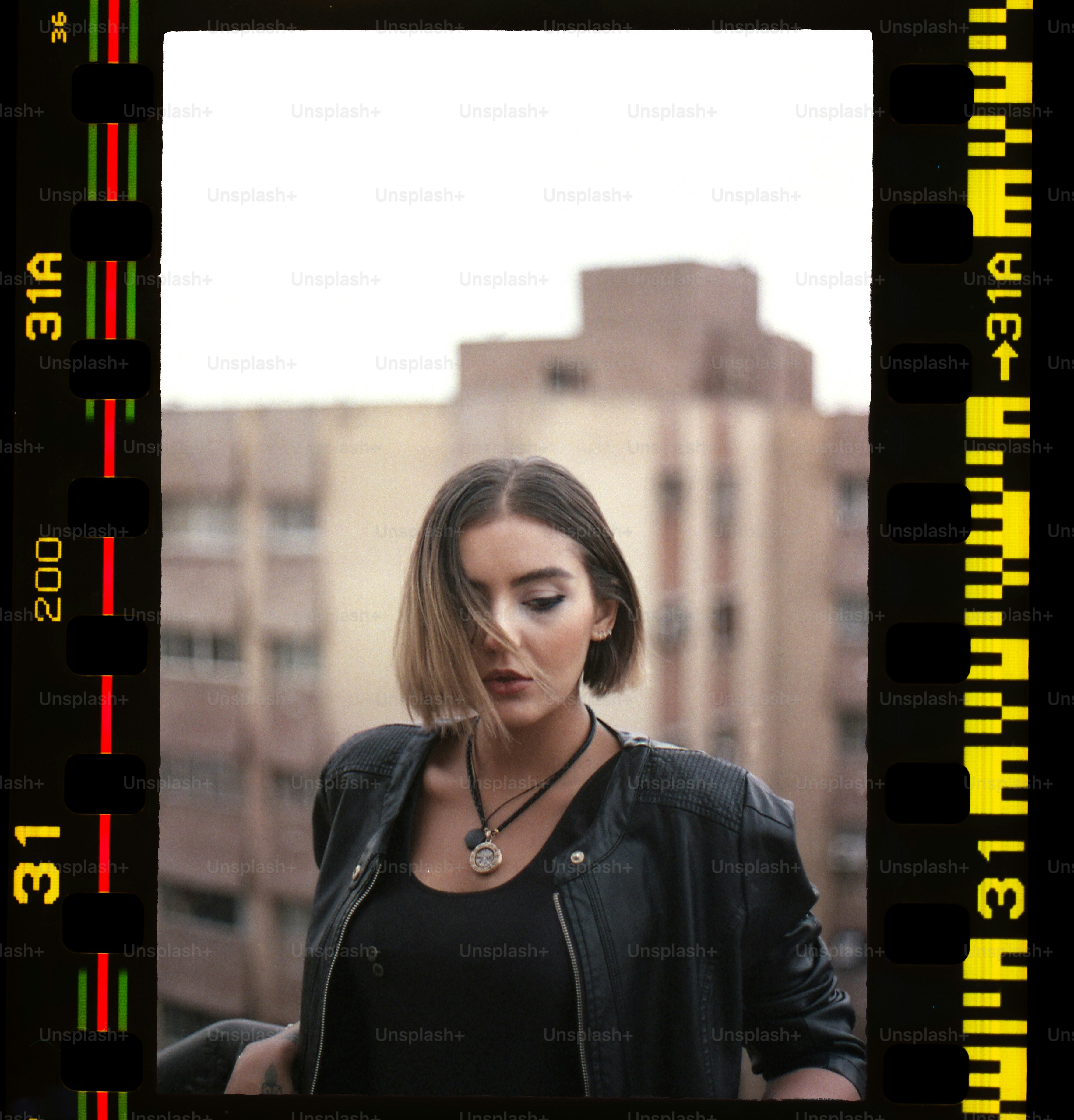 a woman standing in front of a tall building