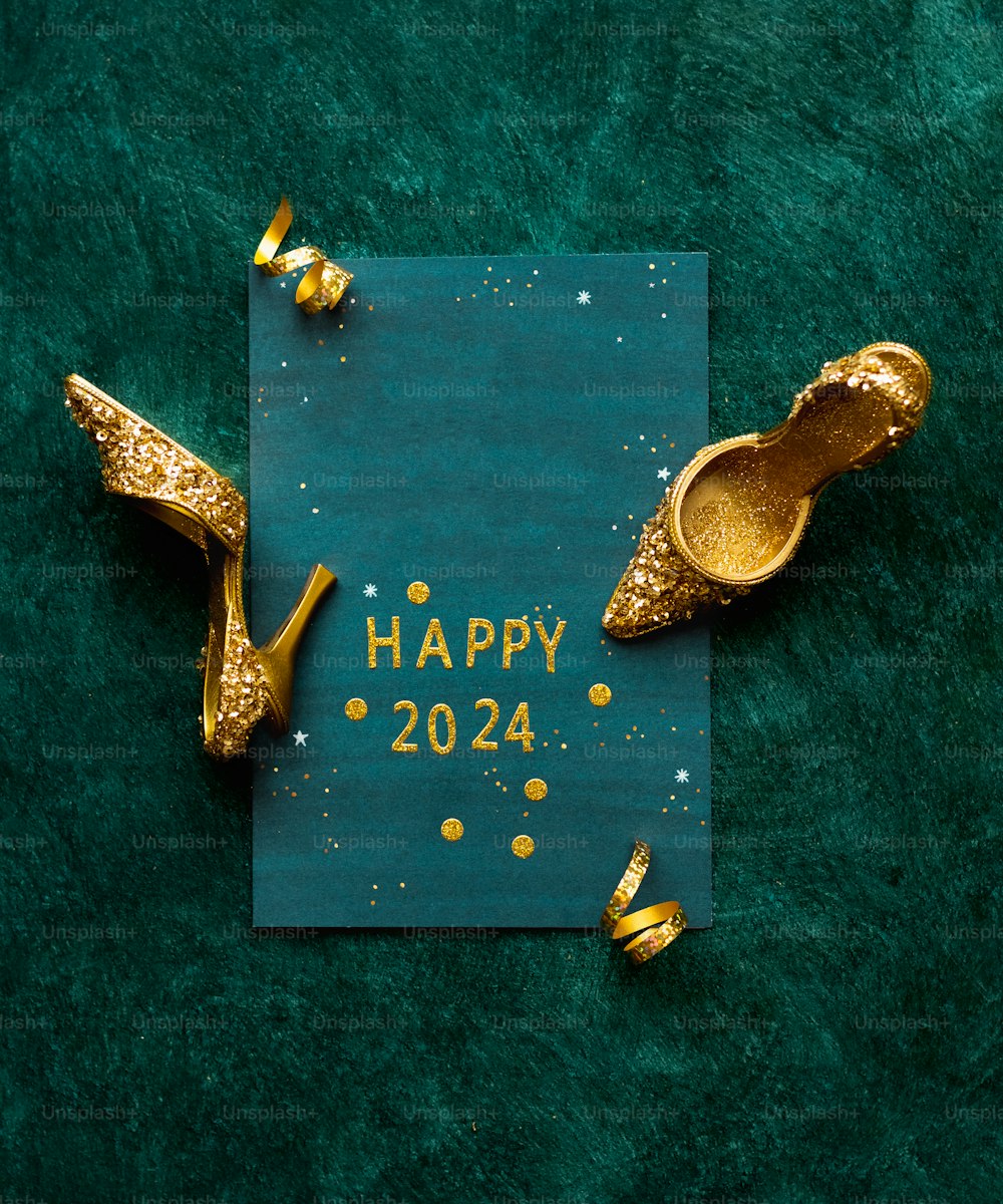 a happy new year card with gold shoes and confetti