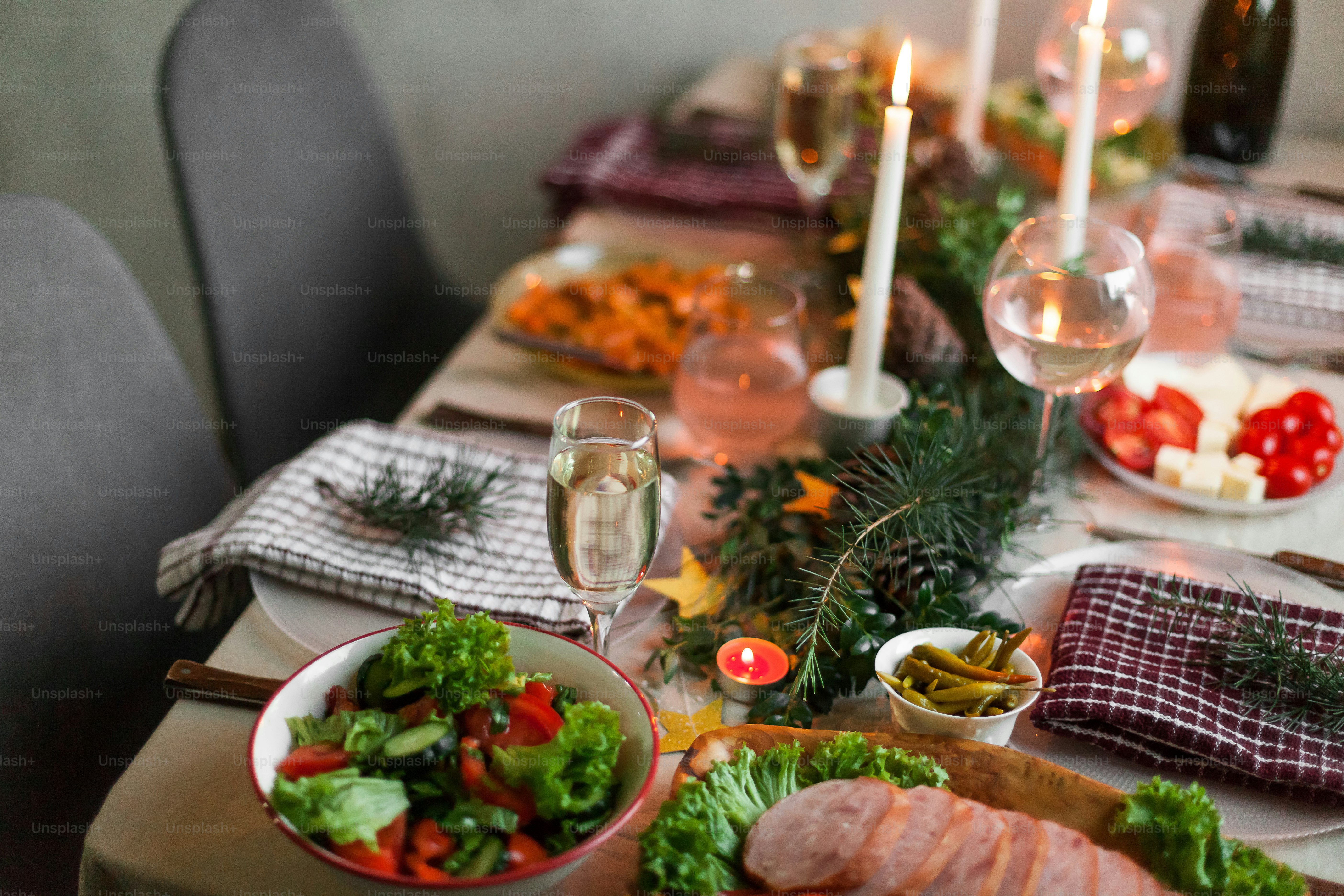 A table with a plate of food and a glass of wine photo – Christmas ...