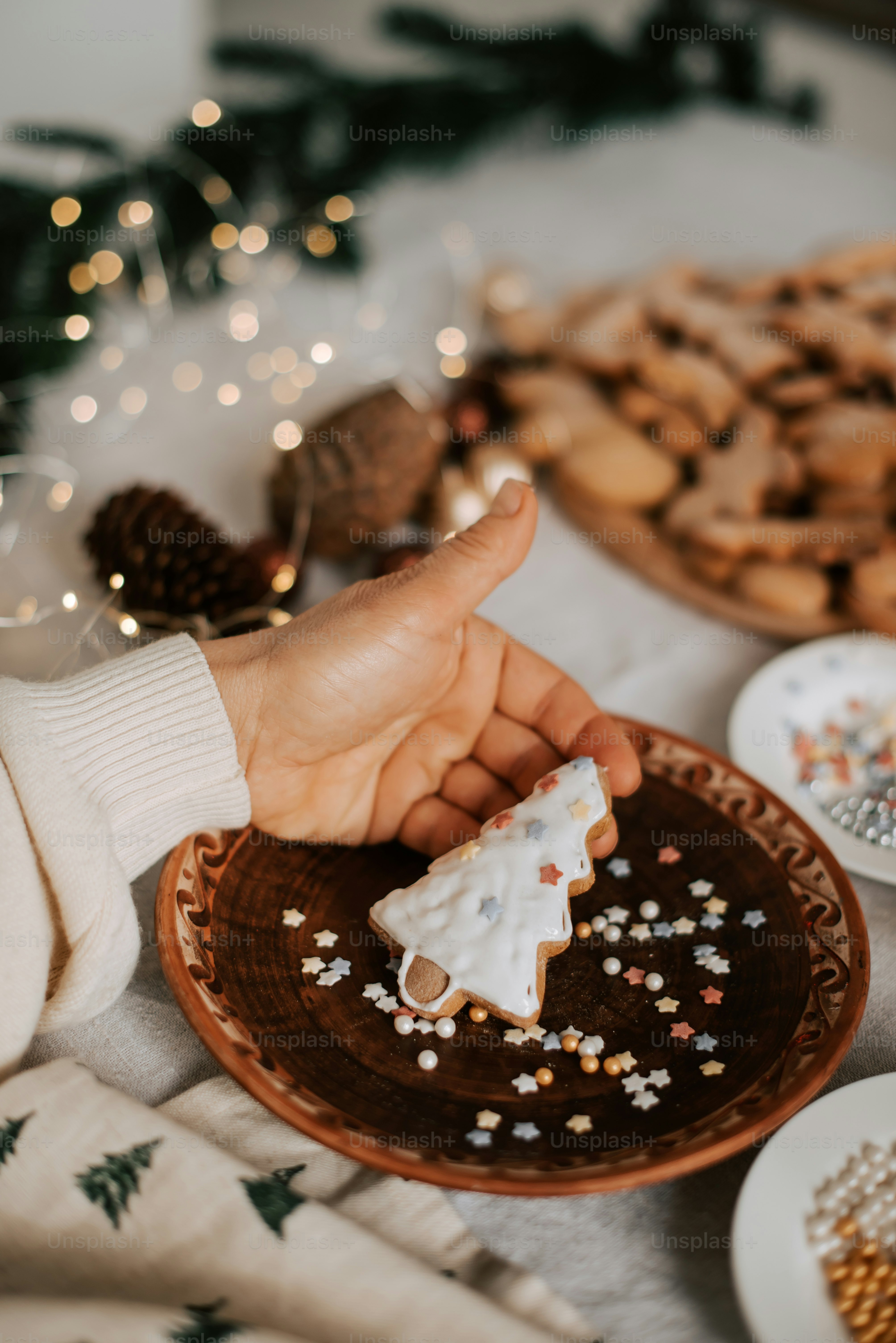 a person holding a piece of food on a plate