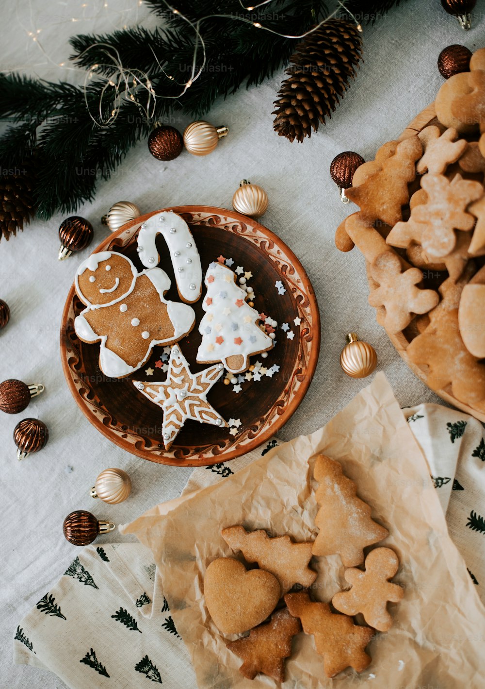 a plate of ginger cookies next to a bowl of cookies