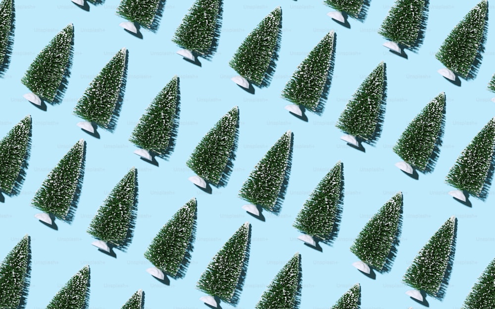 a pattern of small trees on a blue background