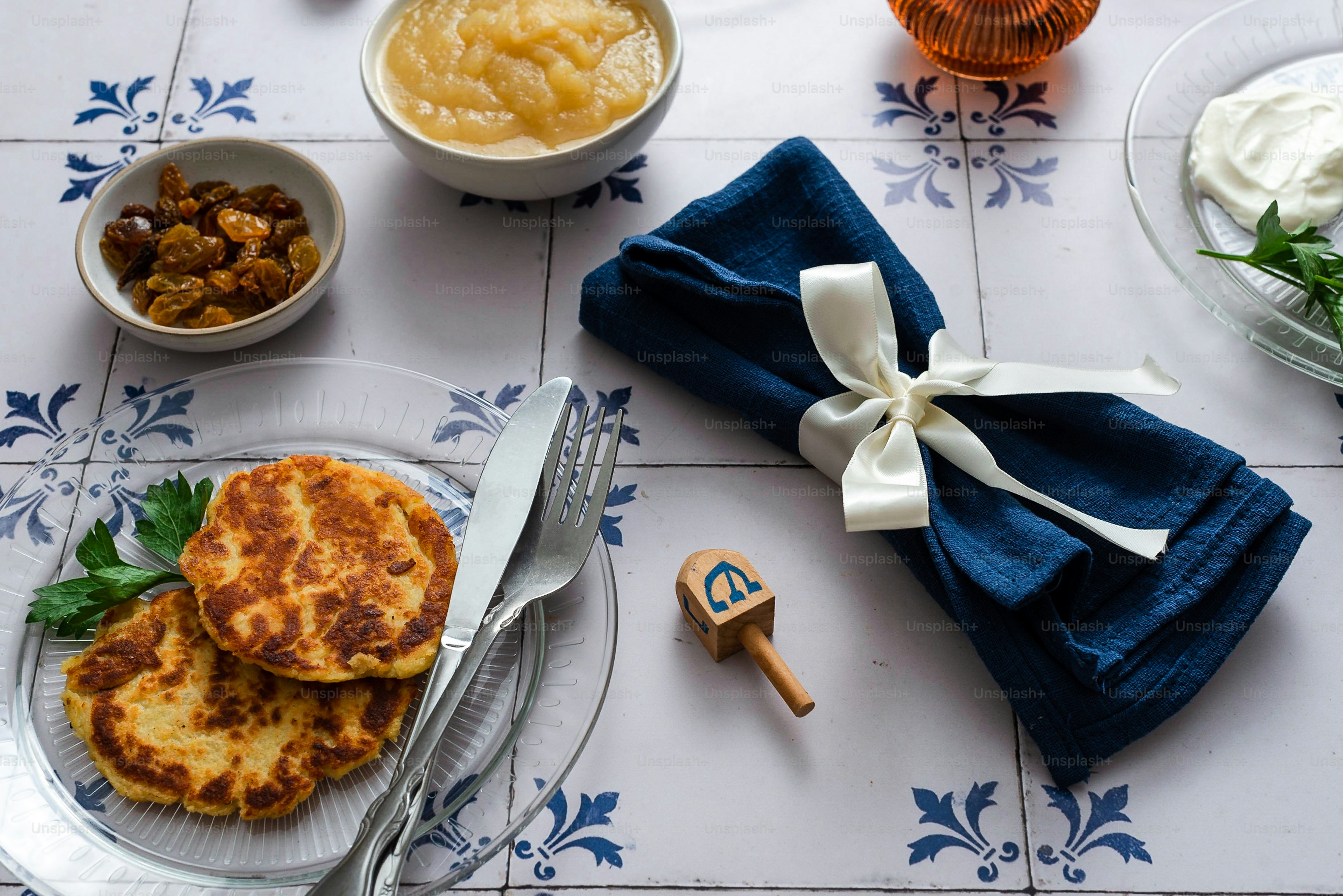 a white table topped with plates of food