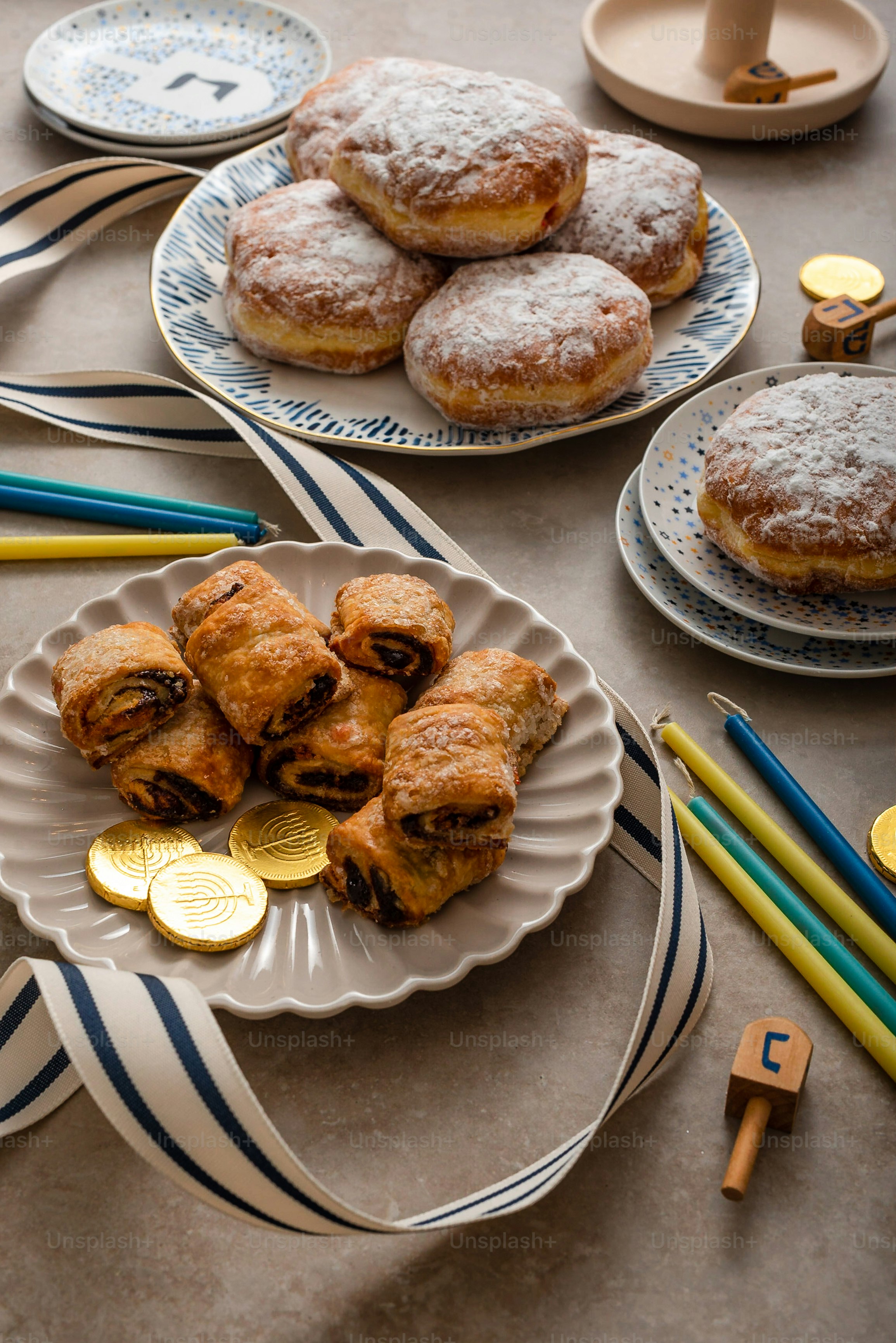 a table topped with plates filled with pastries