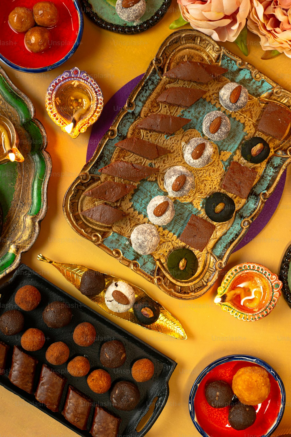 a table topped with lots of different types of desserts