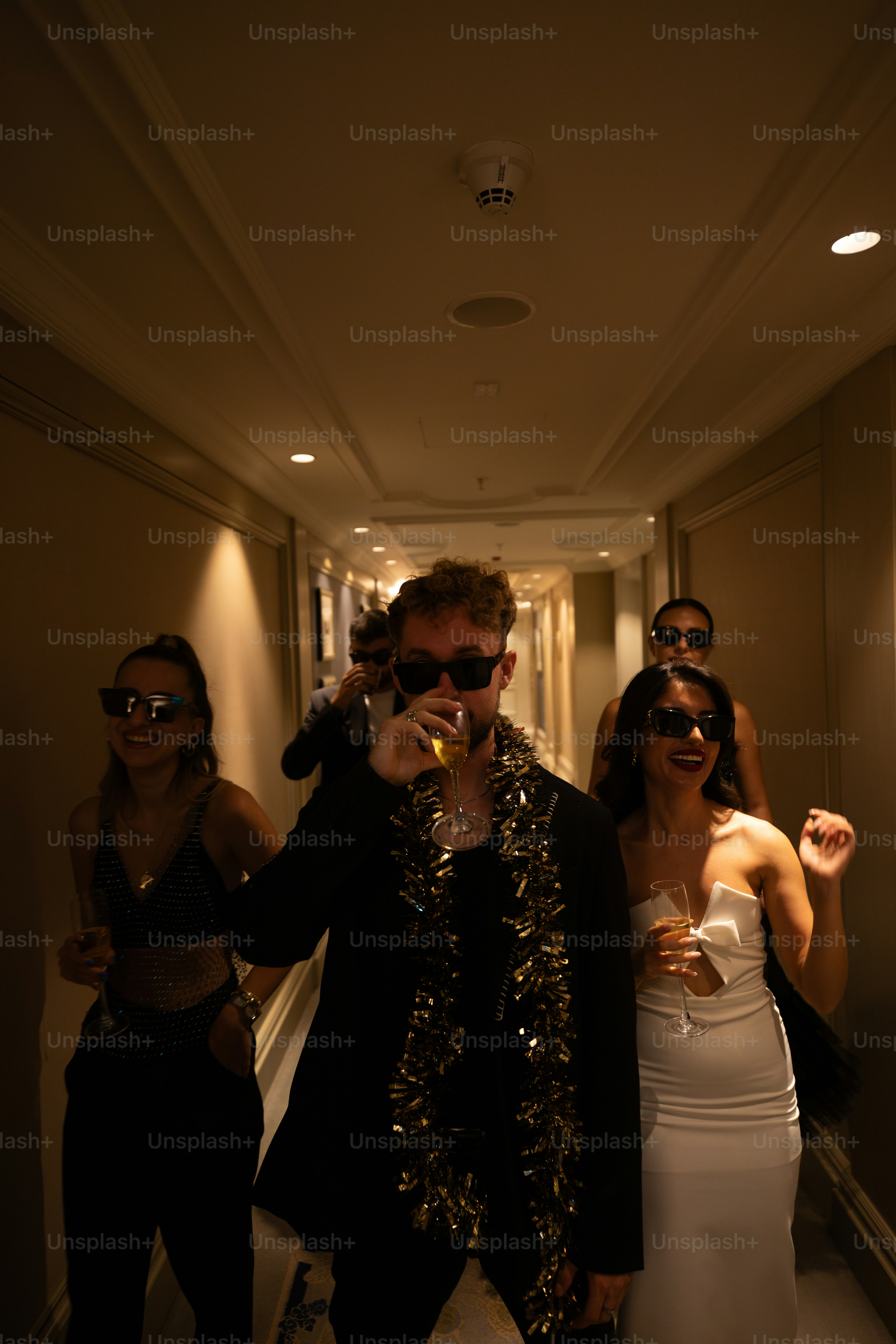 a group of people standing in a hallway