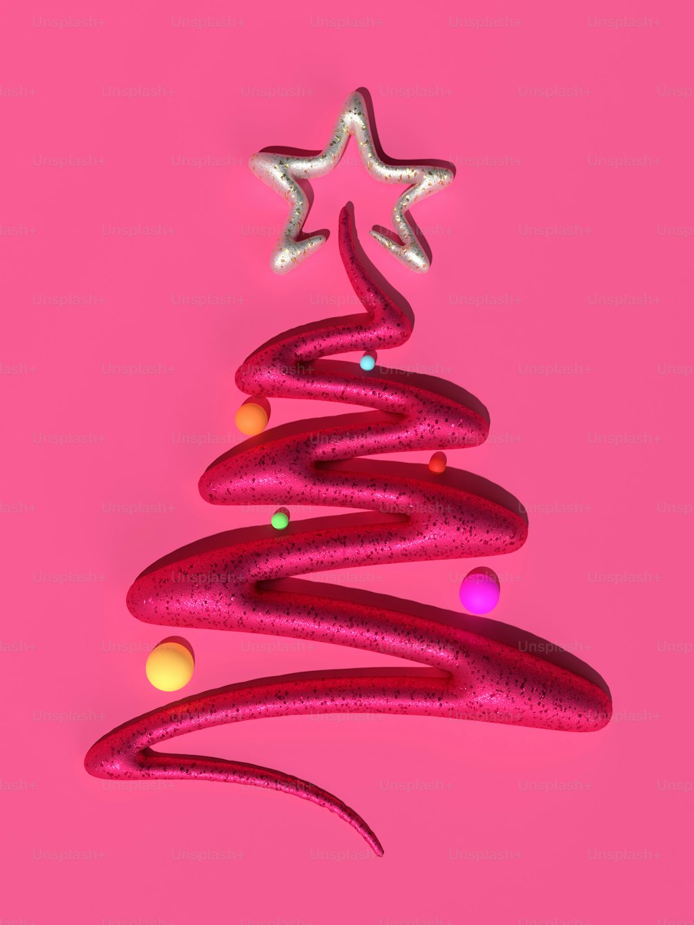 a pink christmas tree on a pink background